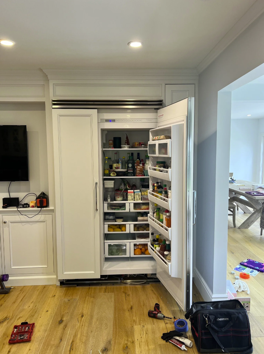 Built-in panel-ready refrigerator with French doors open