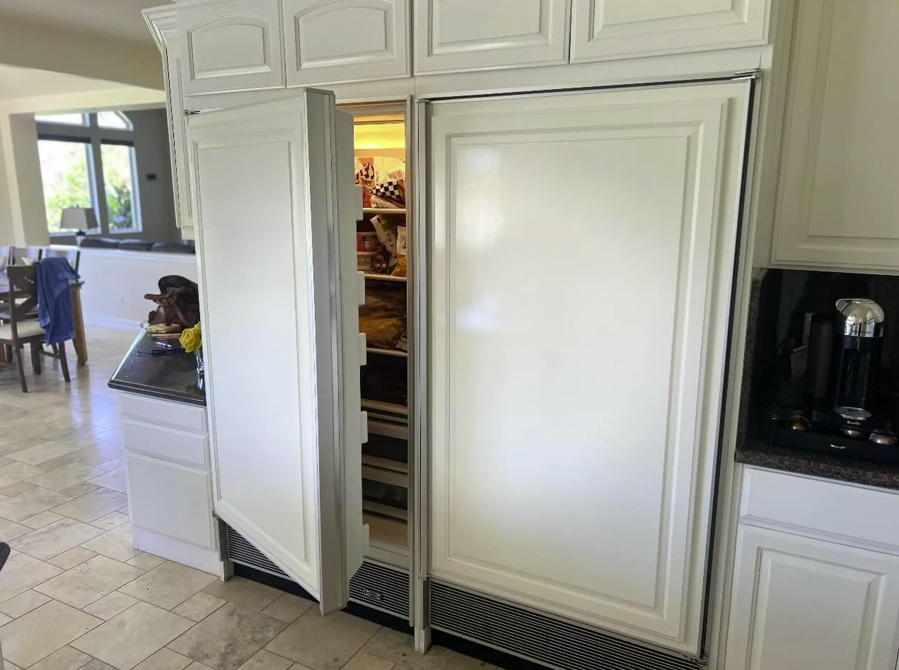 Built-in side-by-side refrigerator with custom panels